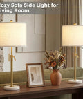 Gold Table Lamps Set Of 2 With Adjustable Height From 22 To 30 Inches on a console in a cozy living room setting