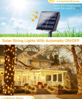 Two Pack 66ft Outdoor Solar String Lights With 200 LEDs Waterproof Copper Wire 8 Modes Warm White Twinkle Lights For Garden Patio Tree Wedding Christmas Fence Decor illuminating a house and garden at night.