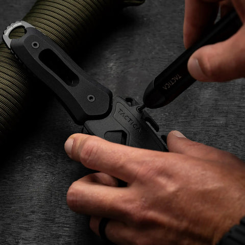 Using 9 in 1 Precision Screwdriver Set for Knives and Gear Maintenance with Pocket EDC Tool on black tactical knife