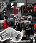 Heavy Duty Hydraulic Fitting Half Inch Male NPTF To Half Inch NPSM Female Swivel 90 Degree Elbow SAE Pipe Joint Connector Built To Last Forged Carbon Steel Hose Adapter For Hydraulic Systems, installed in a hydraulic line