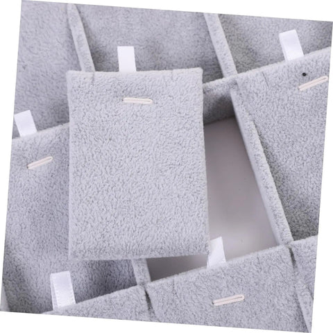 Close-up of the soft dividers in the Lowkey Perfect Multi Grid Jewelry Tray For Rings And Necklaces With Smart Dividers.