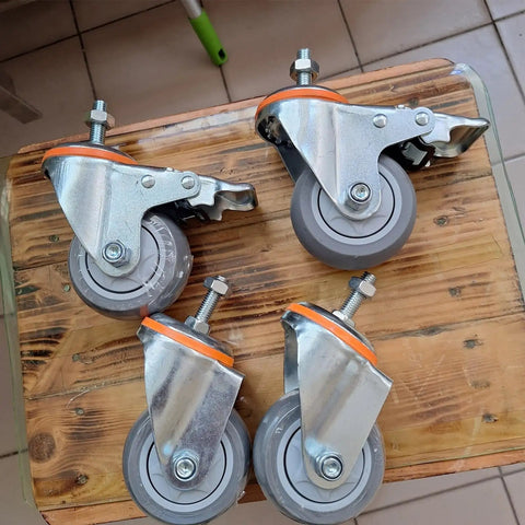 5 Inch Heavy Duty Castor Wheels With TPR Swivel Base, M12x30mm Threaded Stem, Dead Silent Roll, Floor Savers Rubber Tread, Set Of Four Industrial Casters on wooden surface.