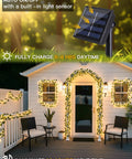Solar Ivy String Lights Outdoor Waterproof 33Ft 100 LED Fake Vines illuminate house and patio at night with warm white light