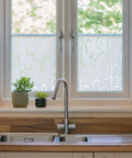 Privacy Window Film Bamboo Pattern Reusable Static Cling For Glass Surfaces installed on kitchen windows with plants nearby