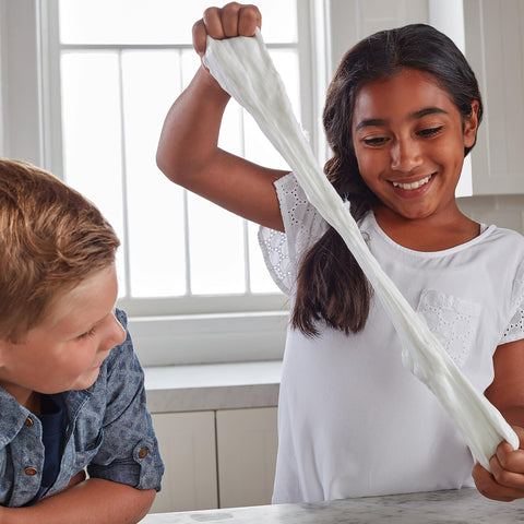 Children playing with slime made using Liquid School Glue That Bonds Paper, Wood, Fabric And More, Washable, Safe And Non Toxic, Dries Clear, 4oz Bottle