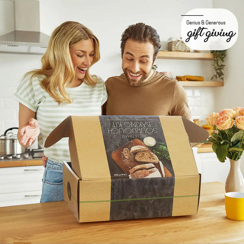 Couple opening All In One Sourdough Starter Kit With Pot 34 Oz Starter Jar 4 Banneton Baskets Scraper Scale Beginner Guide box