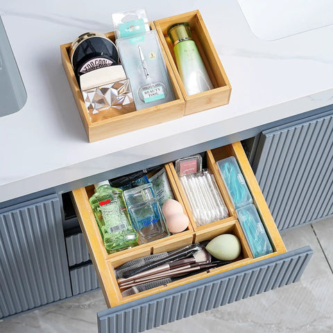 Bamboo Drawer Organizer Set Of 9 For Kitchen And Office in use, organizing cosmetics and toiletries in bathroom drawer.