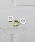 Three-piece thrust ball bearing set: brass inner ring with steel balls between two silver washers, 8x16x5 mm
