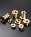Drop In Ready Bronze Flange Bearing Sleeves Built Tough For Heavy Duty Workshop Projects Featuring Smooth Self Lubricating Operation And Bulletproof Wear Resistance For 6 Mm Shaft Daily Use - assorted sizes of bronze flange sleeves on a black background.