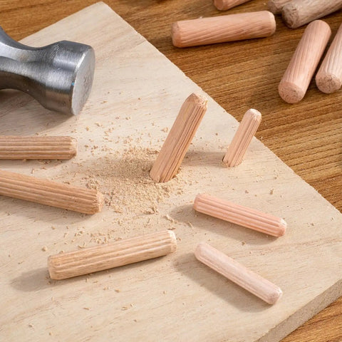 90 Piece Hardwood Dowel Set in Three Sizes One Quarter Inch Five Sixteenths Inch and Three Eighths Inch Fluted Grooved Dowels on Wood
