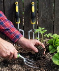 Gardener using 12 Piece Hand Rake Set For Garden Tools Mini Heavy Duty Cultivator 11 Inch Tiller with Handle for Digging Weeding Loose Soil