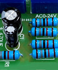 Close-up of metal film resistor assortment kit with 150 values and 1500 pieces, half watt, 1% tolerance, on circuit board