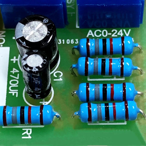 Close-up of metal film resistor assortment kit with 150 values and 1500 pieces, half watt, 1% tolerance, on circuit board