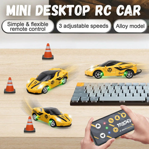 Mini One Sixty Four Scale RC Car With 2.4GHz Remote Control And 3 Speed Modes Rechargeable Desktop Toy Race Car Gift For Boys Ages Four To Twelve Yellow beside keyboard and traffic cones.