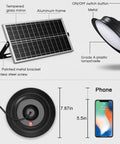 Dual Color Solar Shed Lights 2 Pack With Remote showing solar panel, pendant lamp, and size comparison with phone.