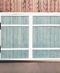 Installed Insaga 6.7-inch heavy-duty gate hinges on a white-framed blue wooden double gate