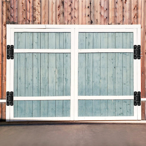 Installed Insaga 6.7-inch heavy-duty gate hinges on a white-framed blue wooden double gate
