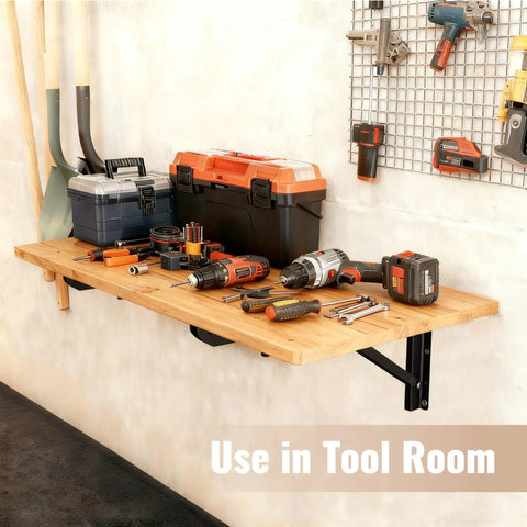 Wall Mounted Folding Table For Garage And Laundry Room Use, Handy Home Wall Desk And Folding Workbench, Space Saver That Handles Up To 100 Lbs, Solid Wall Mount Only, 15.7 By 31.5 Inches, Easy Fold Down Surface with tools displayed on it.