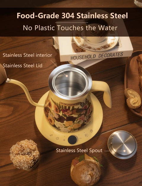 Floral Design Gooseneck Electric Kettle With 0.8L Capacity Precise One Degree Fahrenheit Temperature Control 1200W Fast Heat Auto Shut Off Built In Brew Timer BPA Free Stainless Steel For Pour Over Coffee And Tea Lovers on wooden table with stainless steel lid and spout visible.