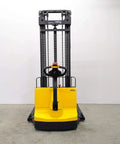 Built Tough Electric Wide Leg Pallet Stacker Heavy Lifter With 2204 Lbs Capacity And 130 Inch Lift Featuring Maintenance Free Battery 110V Us Plug Speed Control And Three Year Warranty Yellow front view