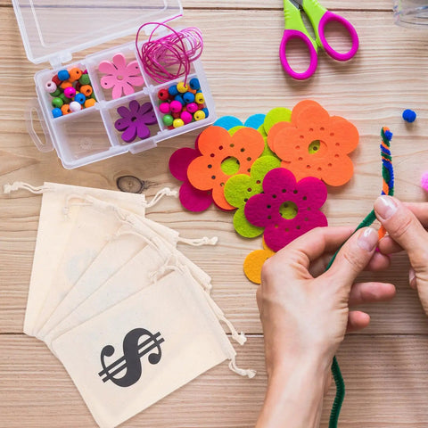 Beige Cotton Drawstring Gift Pouches With Money Sign for Cowboy Party Decor and Birthday Party Favors, 10x15cm, 24 pack beside craft supplies