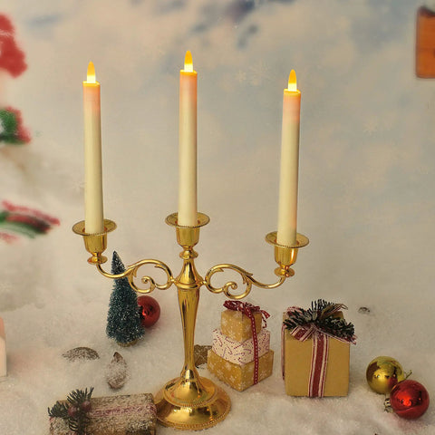 LED Taper Candles With Remote Control, Rechargeable Amber Glow, 6 Pack displayed on golden candelabra with holiday decor