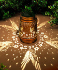 Outdoor Solar Lantern With Hummingbird Pattern, Waterproof Metal Garden Light casting decorative glow on patio, easy installation