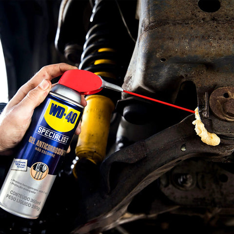 Gel Lubricant With Smart Straw Sprays Two Ways, 10 Oz, applied on a car suspension part, demonstrating no mess application.