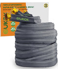 GUKOK garden hose, 50 ft non-expanding, grey fabric with brass fittings, coiled beside its box.