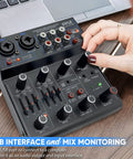 Person adjusting 4 Channel Wireless DJ Mixer With Bluetooth 5.x USB Audio Interface And 2 Combo Jacks XLR 6.35mm