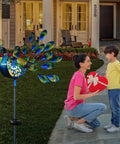 Peacock Solar Garden Stake Lights For Pathways And Backyard Decor Metal Outdoor Lights near porch with mother and child