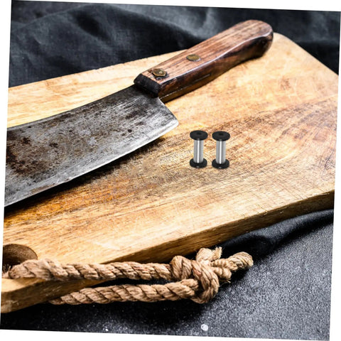 Boss Grade Stainless Steel Knife Handle Screws With Locking Spindle Pins Two Pack next to a cleaver on a cutting board.