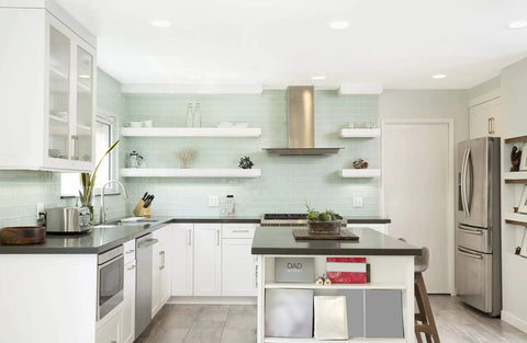 Top Shelf 6 Inch LED Recessed Downlights With Adjustable Color Temperature illuminating a modern kitchen with light green tiles.