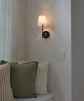 Slick Gliding Touch Led Dimmer Switch With Integrated Locator Light Single Pole Three Way Wiring Configuration For House Fixtures Heavy Duty Craftsmanship No Sweat Install next to a modern wall sconce and pillows.