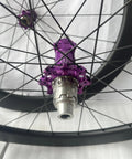 Close-up of purple hub on 700C Deep Section Carbon Road Bike Wheelset With 60mm Rim Depth And 28mm Width Tubeless Clincher
