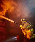Firefighter using the Vulcan 180 Lantern Cranks Out 1200 Lumens With 548M Beam, 180-Degree Articulating Head That Locks Forward