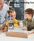 Children using 83 Real Element Samples Periodic Table Kit With Wooden Stand And Magnifying Glass in a classroom setting.