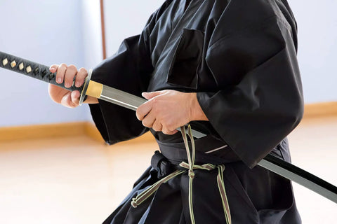 Person training with a Lightweight Aluminum Alloy Katana Iaito For Iaido Training With Unsharpened Blade 28 Inch Blade