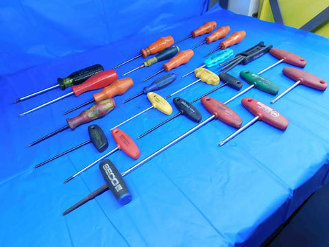 Pro Grade Hardened Steel Torx Drivers 25 Piece Assorted Sizes T9 To T40 Heavy Duty Repair Kit For Mechanics And Handymen on blue background.