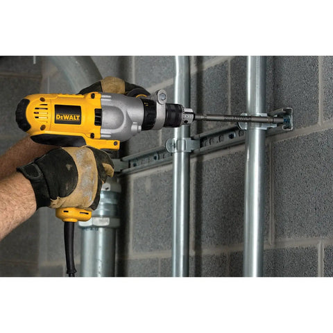 Corded Hammer Drill Kit With Half Inch Capacity And Ten Amp Power For Masonry Wood And Steel Drilling Dual Mode Hammer And Drill Built For Pros And Serious DIYers Who Need Beefy Power being used on masonry wall