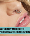 Nose piercing close-up with hoop jewelry; Piercing Aftercare Spray Isotonic Saline Cleanser For New And Existing Piercings 4 Oz