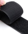 Close-up of adjustable outdoor sofa straps and clips for patios, sectional sofas, rattan or wicker furniture with Velcro fasteners.