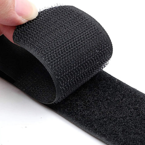 Close-up of adjustable outdoor sofa straps and clips for patios, sectional sofas, rattan or wicker furniture with Velcro fasteners.