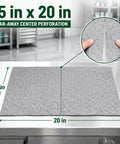 Heavy Duty Oil Absorbent Pads 15 By 20 Inches 50 Pack on stainless steel table with perforation detail.