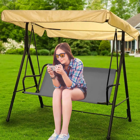 Person sitting on swing with Thick 600D Oxford Waterproof Swing Seat Cover Replacement For 3 Seat Outdoor Patio Garden Benches Cushions Protection Gray 58.2 19.7 19.7 Inches Heavy Duty Stitching All Weather Rainproof