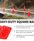 Multiple Ten Pack 28 Inch PVC Traffic Cones With Reflective Collars on wet road, showing heavy-duty square base and stability features.