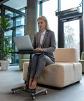 Woman using Height Adjustable Laptop Rolling Cart For Ergonomic Workstation Use, Mobile Desk From 28 Inches To 33 Inches, Black Finish