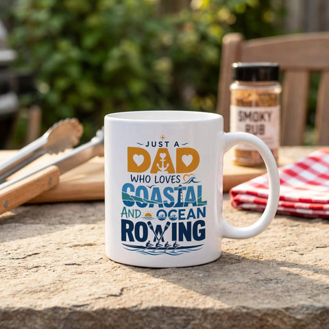 Just A Dad Who Loves Coastal And Ocean Rowing 11oz White Ceramic Coffee Mug Double Sided Print Gift For Dad, outdoors on table