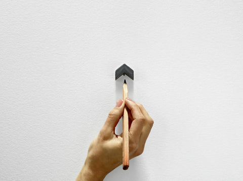 Hand marking wall with Claw Drywall Picture Hanger Set, Holds 45 Lbs Per Hook, Includes 3 Hooks And 3 Spot Markers, Stainless Steel Silver Finish, No Studs Needed, Heavy Duty Wall Hanging For Pictures And Mirrors.