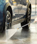Person using Jet Nozzle Power Washer Wand With 2 High Pressure Nozzles And Quick Connectors For Garden Hose to clean car wheels